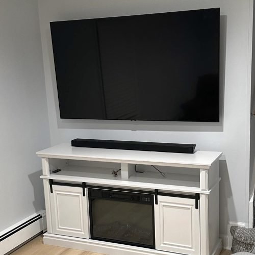 A TV mounted on a wall | TV installation services